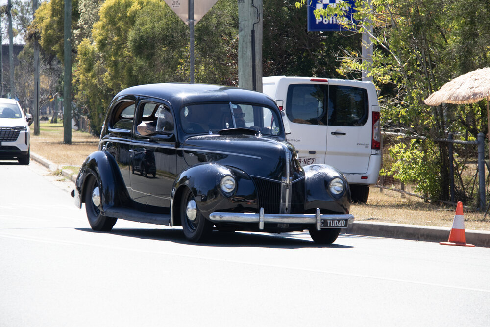Vintage cars driving along Queen Street, during the Marburg Meander, event held as part of Galvanized: A Festival of Heritage, Marburg, Ipswich, September 2026