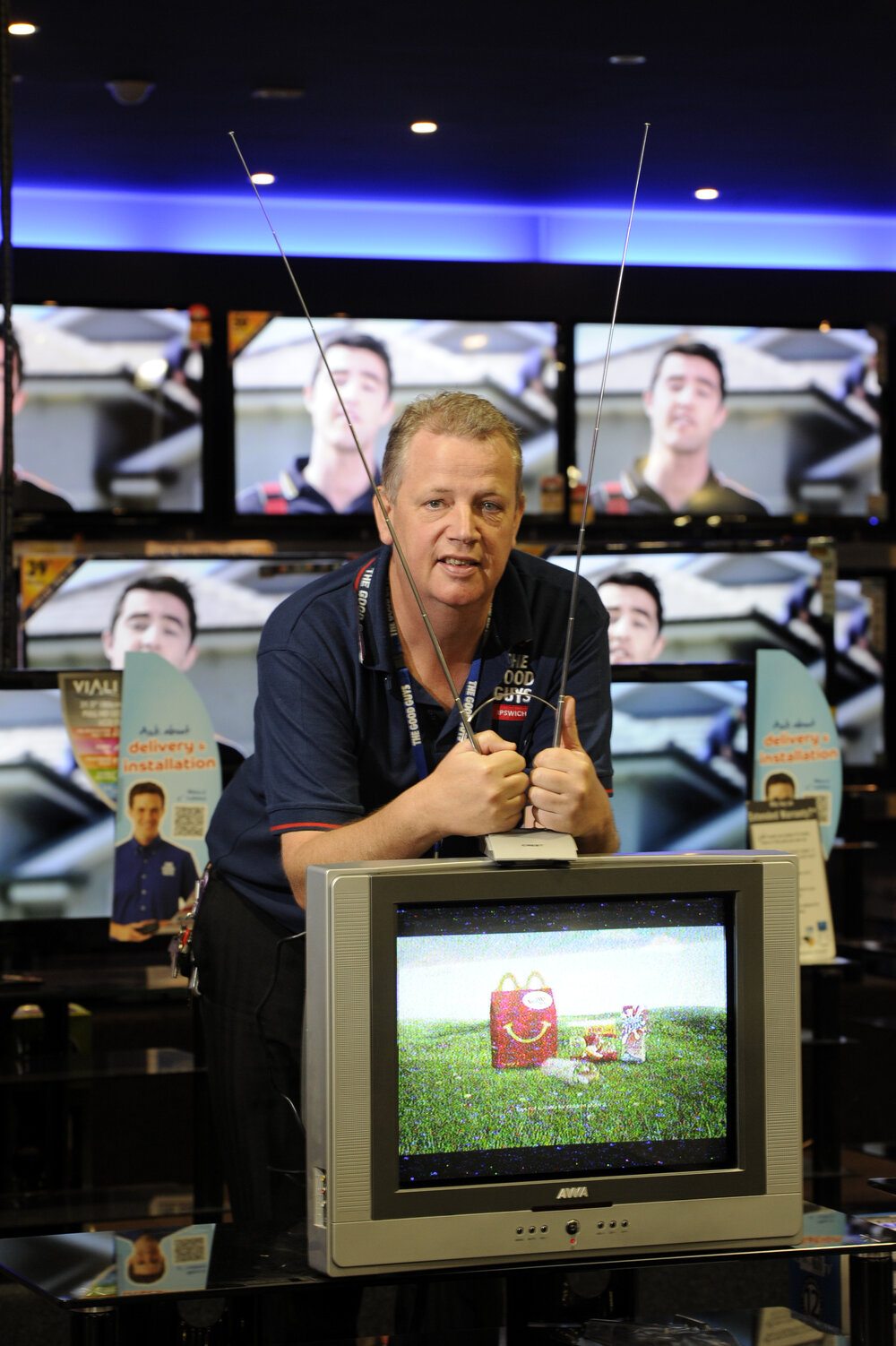 Good Guys store owner Mark Timms moves an old analogue TV, recycling analogue TVs ahead of the digital changeover later this month, Ipswich, 6th May 2013