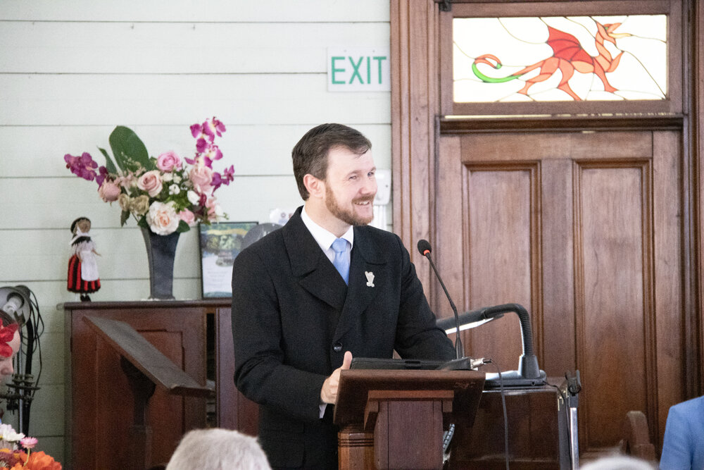 Conductor David Webster sharing the history of the Blackstone-Ipswich Cambrian Choir at the 140th Anniversary service for the United Welsh Church, Blackstone, Sunday 4th October 2026
