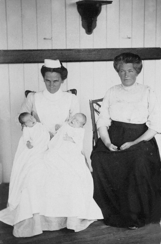 Nurse Linning, holding twin boys of Mrs P McInally, Marburg, 1912