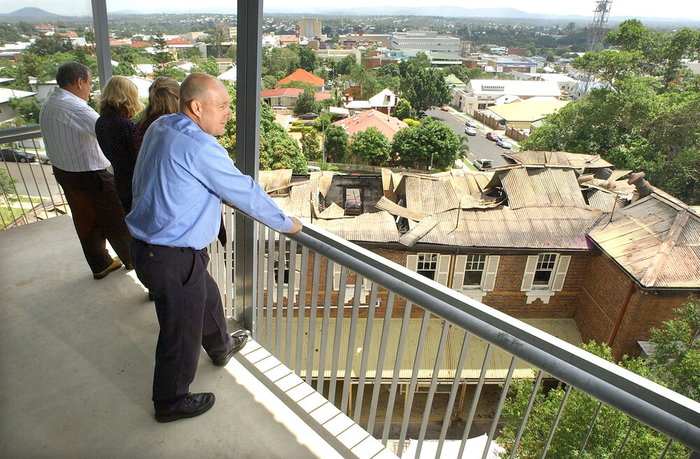 Manager of  Ipswich Hospital Business Services, Ray Chandler, looks over the charred remains of his heritage listed office, Ipswich, 7 February 2005 