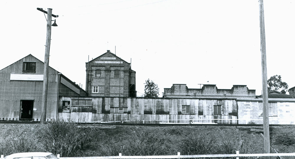 Rear view of the Old Flour Mill, at 231-235 Brisbane Street,  from the railway line, Ipswich, 1940s