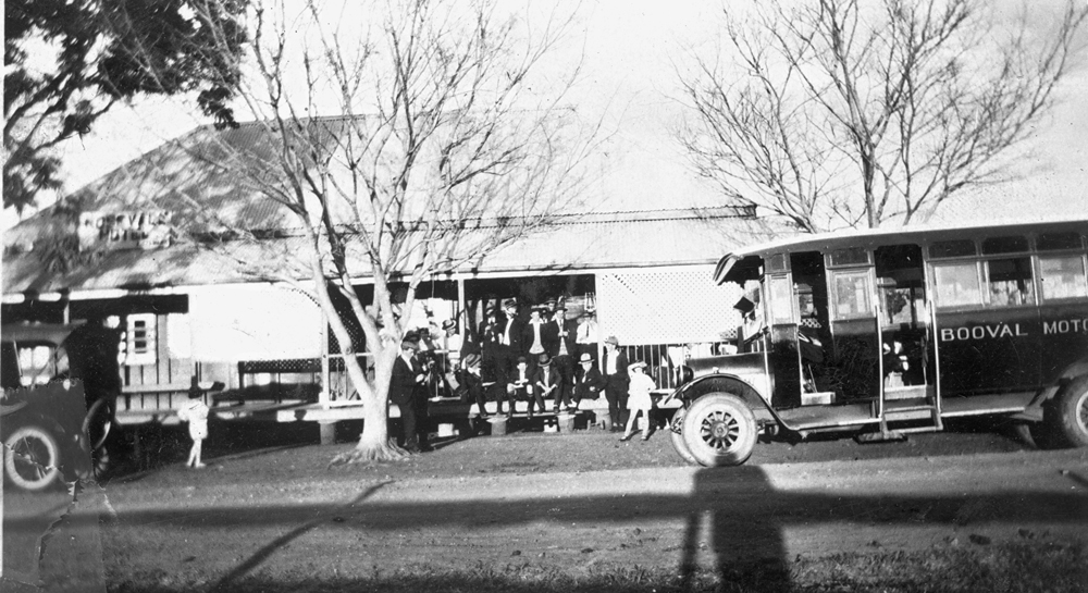 Booval Motor Bus Company vehicle in front of what is thought to be Rosevale Hotel, Rosevale, 1919