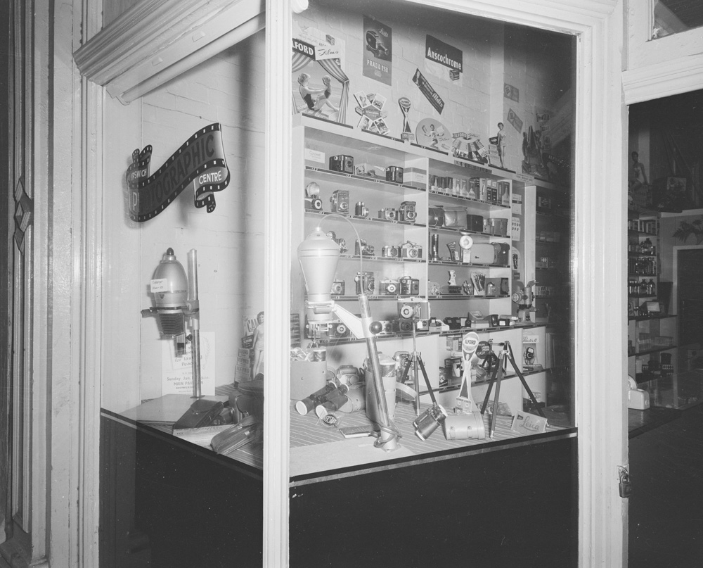 Ipswich Photographic Centre window display and interior, 111 Brisbane Street, Ipswich, 1958