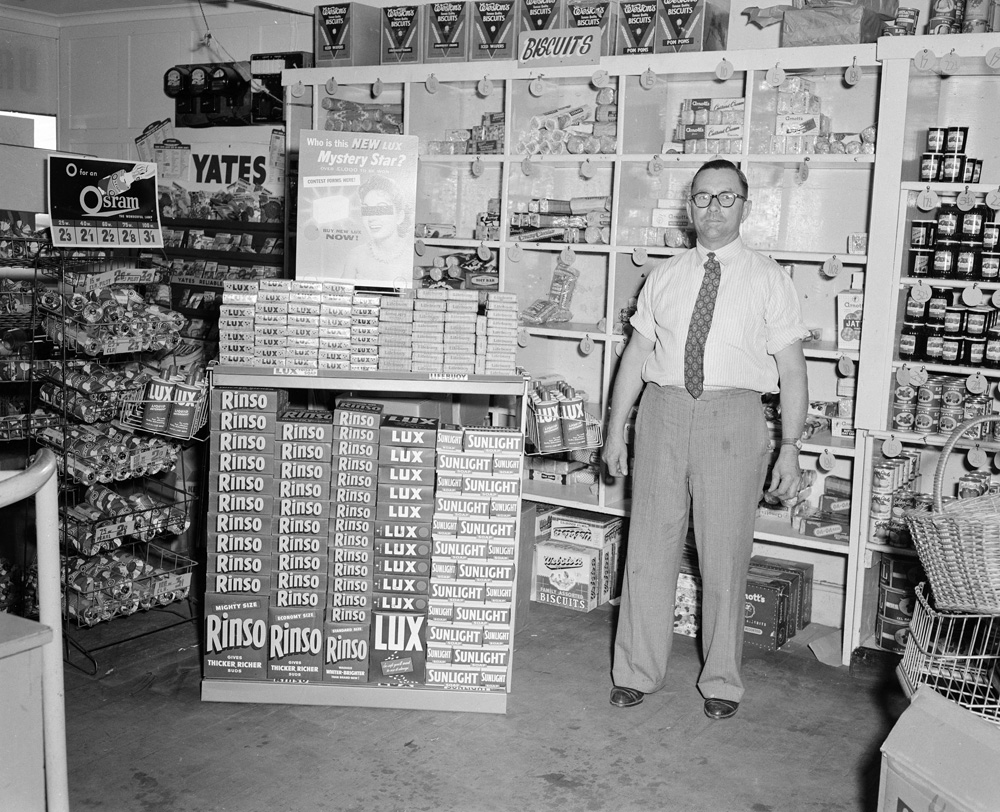 Worker at Cribb &amp; Foote Grocery Department, Brisbane Street, Ipswich, 1959