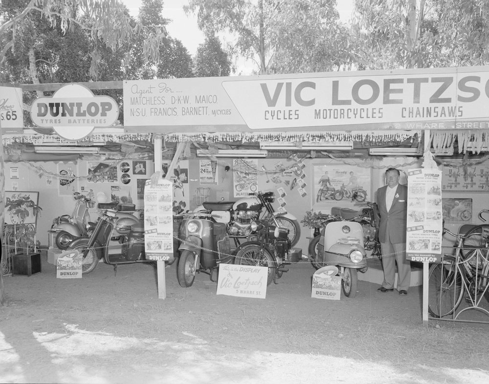 Vic Loetzsch Cycles, Motorcycles &amp; Chainsaws display at the Ipswich Show, Ipswich, 1959.
