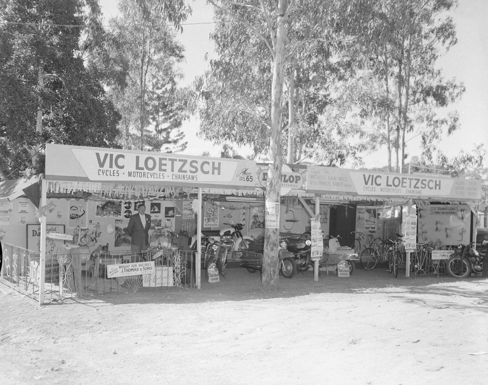 Vic Loetzsch Cycles, Motorcycles &amp; Chainsaws display at the Ipswich Show, Ipswich, 1959.