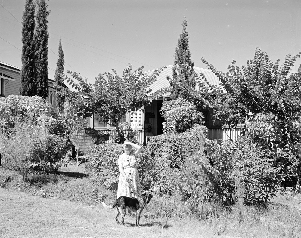 Lady with dog in front of house at 48 Park Street, Ipswich, 1960
