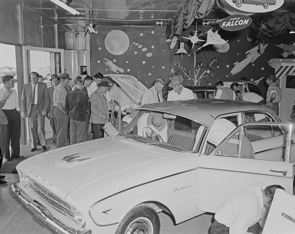 Men looking at  Modern Motors Showroom Ford Falcon display, Brisbane Street, Ipswich, 1960