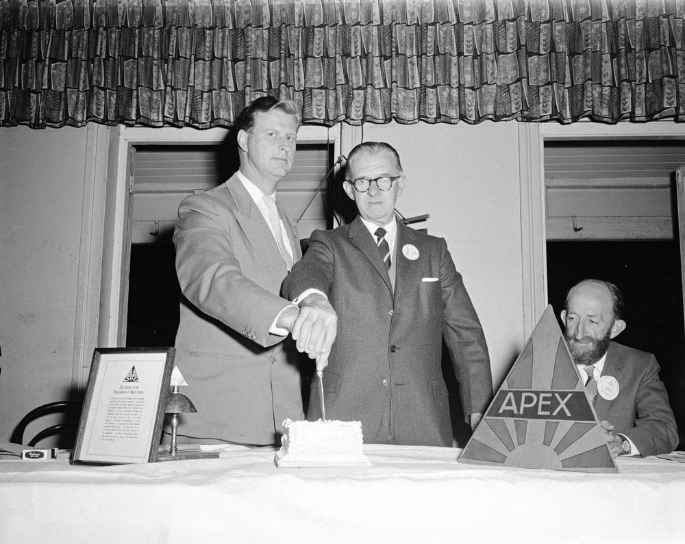 Les Thomas, cutting cake, at Apex Club, Ipswich, 1960