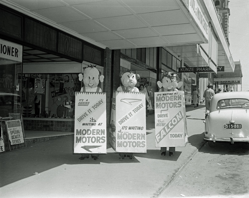 Staff of Modern Motors promoting new Falcon car, Brisbane Street, Ipswich, 1960