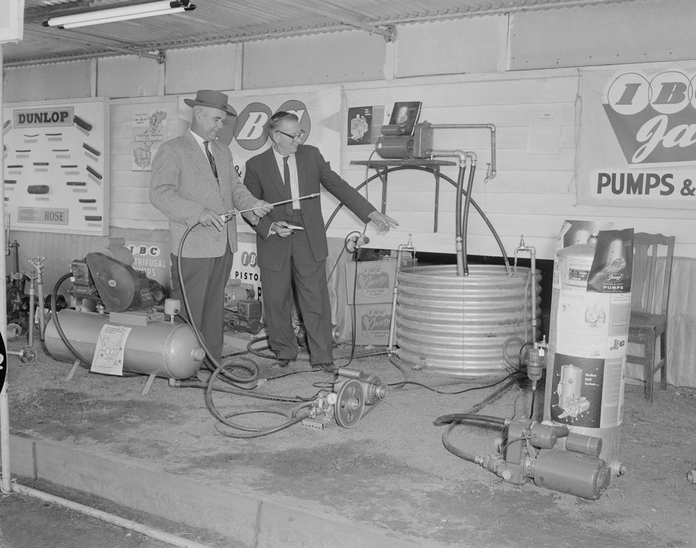 Product demonstration by staff at Mining and Hardware Supplies exterior display, Ipswich Show, Ipswich, 1961