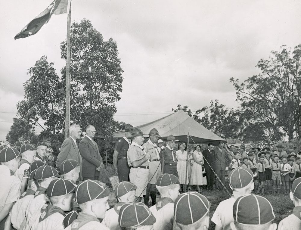 Boy scouts and Cub scouts at a parade with Scout leaders, Ipswich, 1950s