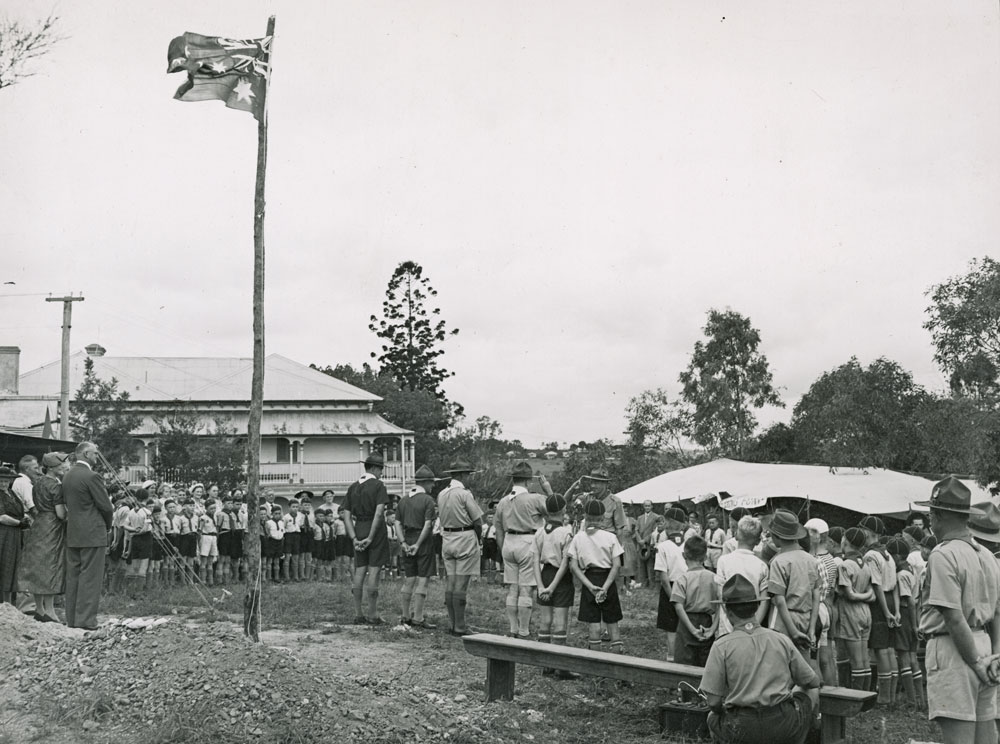 Boy scouts and cub scouts at a parade with scout leaders, Ipswich, 1950s