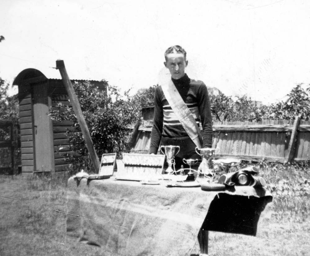 Cyclist, Cliff Mengel, with his trophies, Ipswich, 1930s