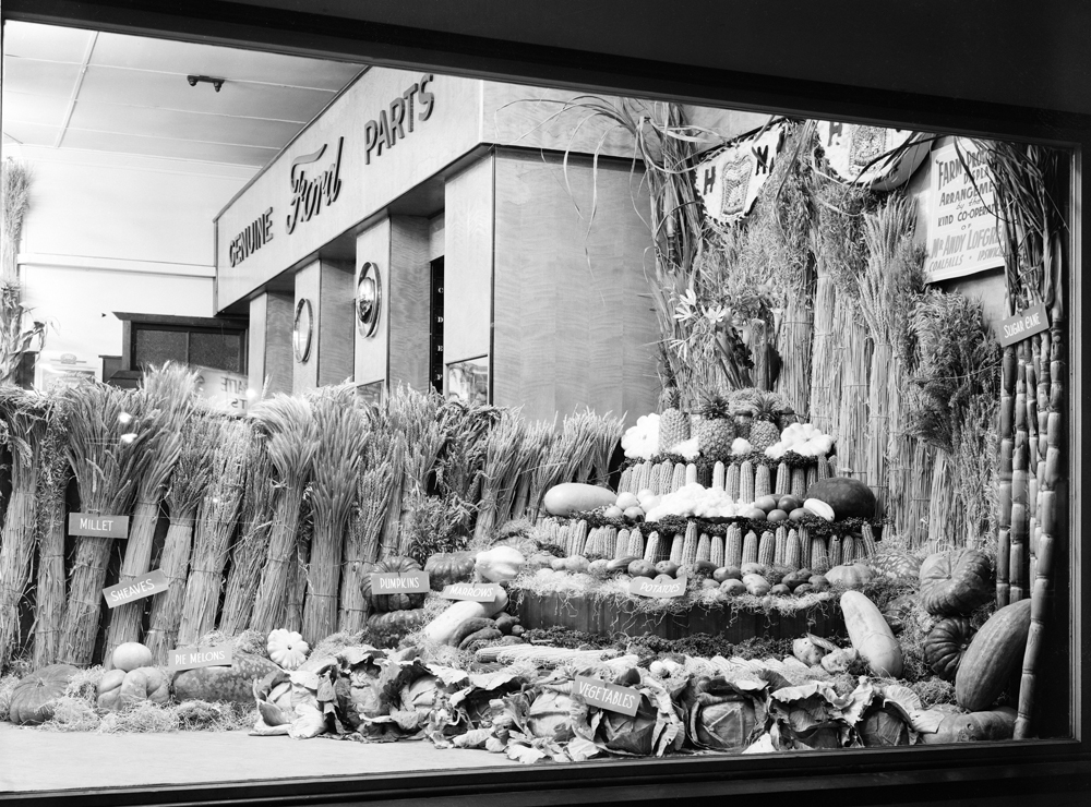 Modern Motors produce display as part of  Fordson Major Tractor display, cnr Gordon &amp; Brisbane Street, 1952