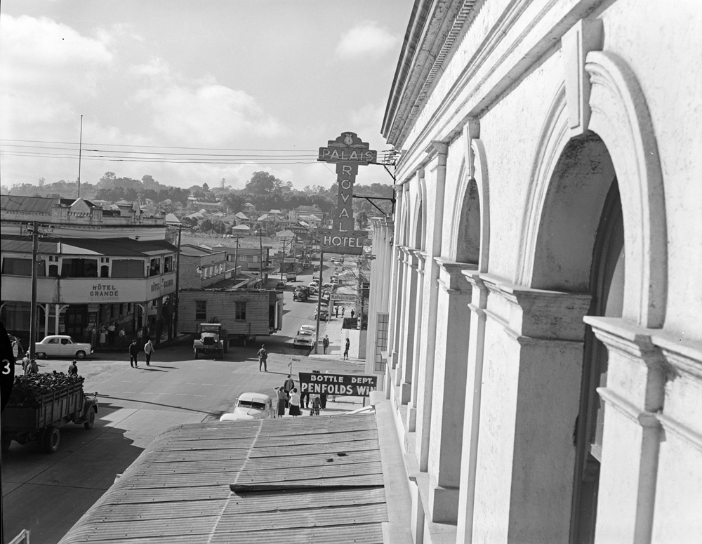 House removal travelling through town, Brisbane Street, Ipswich, 1957