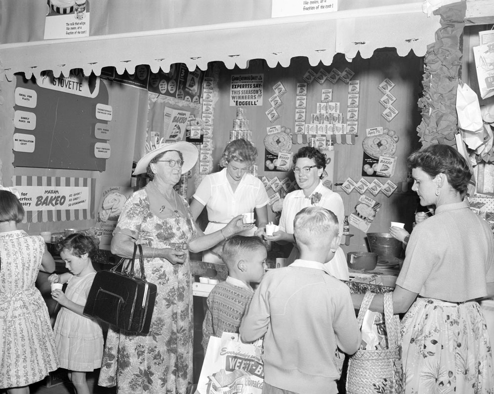 People watching cooking demonstration at the Ipswich Show, Ipswich, 1957