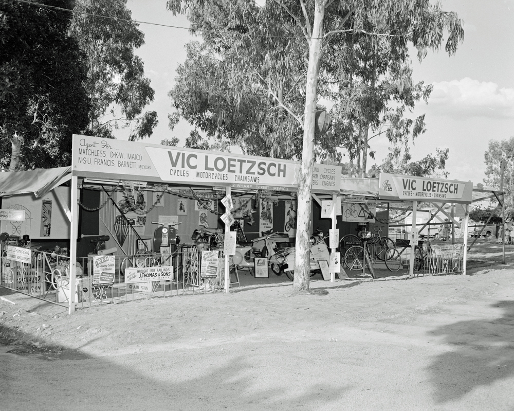 Vic Loetzsch Cycles, Motorcycles &amp; Chainsaws display at the Ipswich Show, Ipswich, 1958