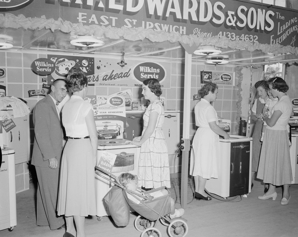 Staff and Show-goers at  the R T Edwards &amp; Sons washing machine display, Ipswich Show, Ipswich, 1958