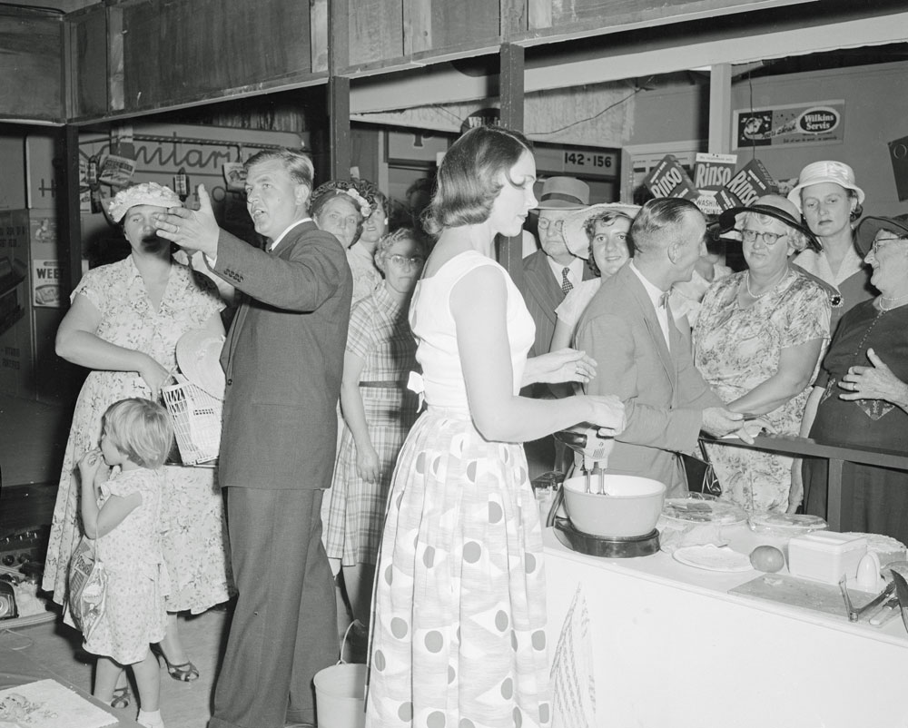 R T Edwards &amp; Sons staff demonstrating electrical kitchen appliances at the their Ipswich show display, Ipswich, 1958