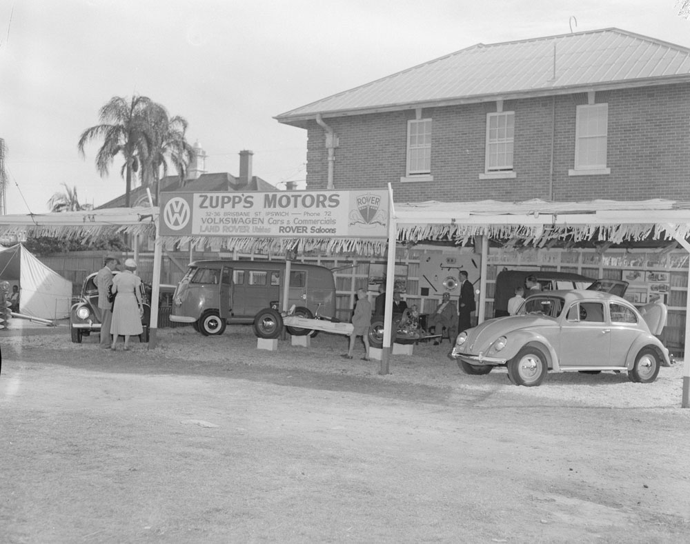 Staff and show-goers at the Zupps Motors Ipswich Show display, Ipswich, 1958