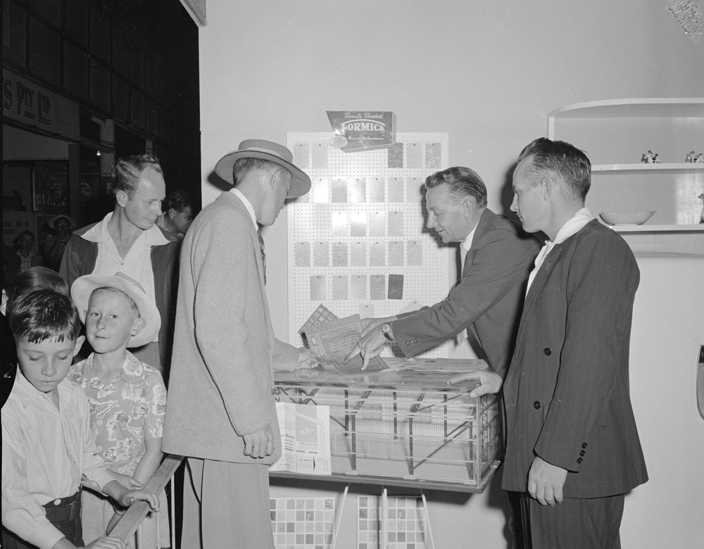 Staff of Ipswich Building Suppliers with customers at their display, Ipswich Show, Ipswich, 1958