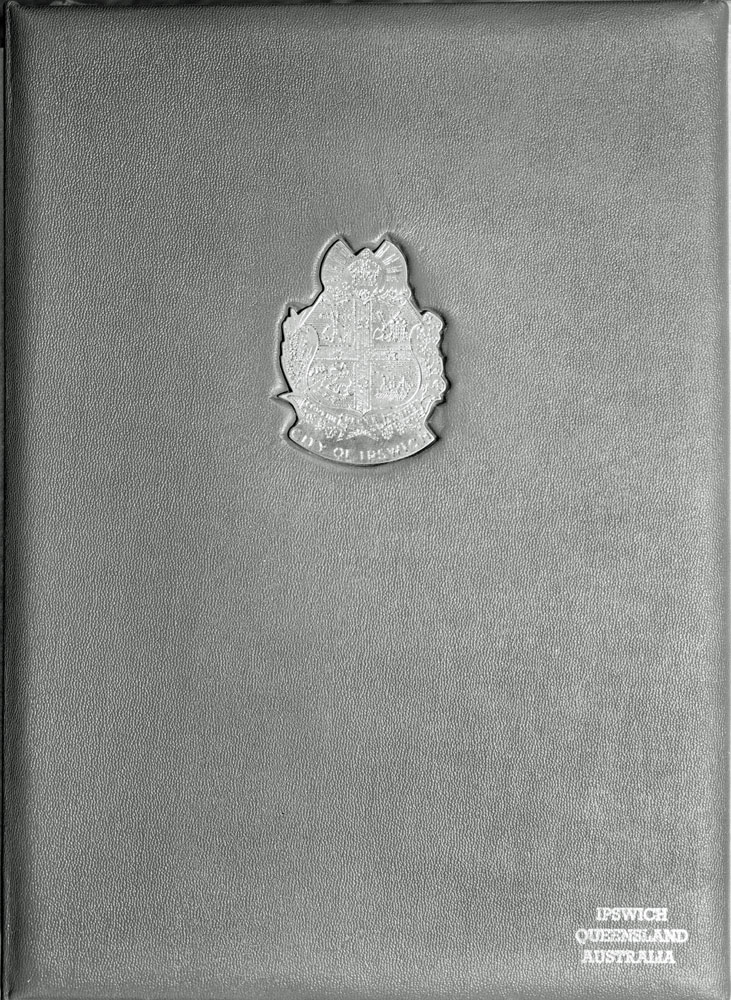 Leather binder holding the framed illuminated address presented  to the Queen Mother during her visit  to Ipswich, 1958