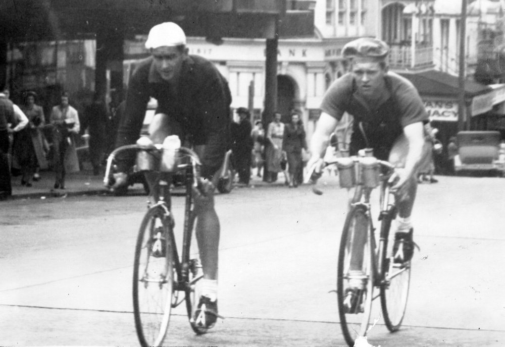 Reg Wettling and Jack Dobbie in Brisbane Street, Ipswich during a 100 mile race from Goodna to Esk return, 1945-1950