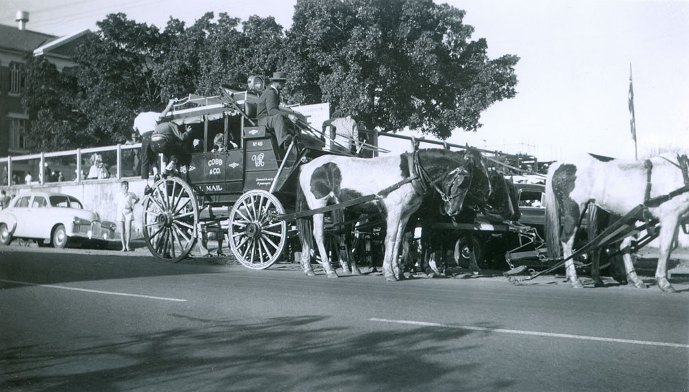 Cobb &amp; Co re-enactment coach in front of Ipswich North State School, North Ipswich, 1950s