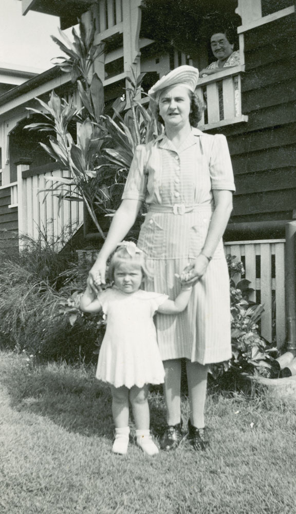 Mother and daughter in front of home at 12 Delacey Street, North Ipswich, 1946