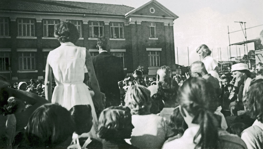 Spectators outside Ipswich North State School watching parade, North Ipswich, 1950s