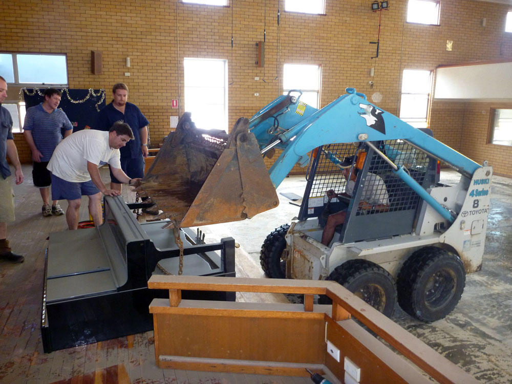 Cleaning up after flood damage at The Salvation Army Church, Bundamba, Ipswich, 2011