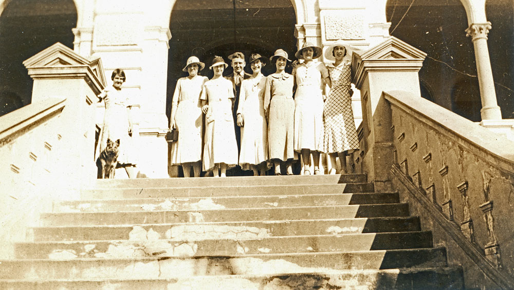 Staff from Frank E Duncalfe's Mens Store on the steps of Brynhyfryd, 1 High Street,  Blackstone, Ipswich, c.1932