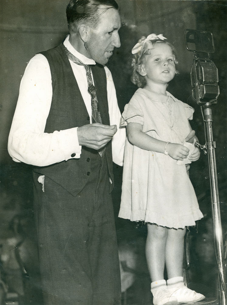 William Johnson, Managing Director of Radio Station 4IP, with unidentified child, maybe charity event, Ipswich, early 1950s