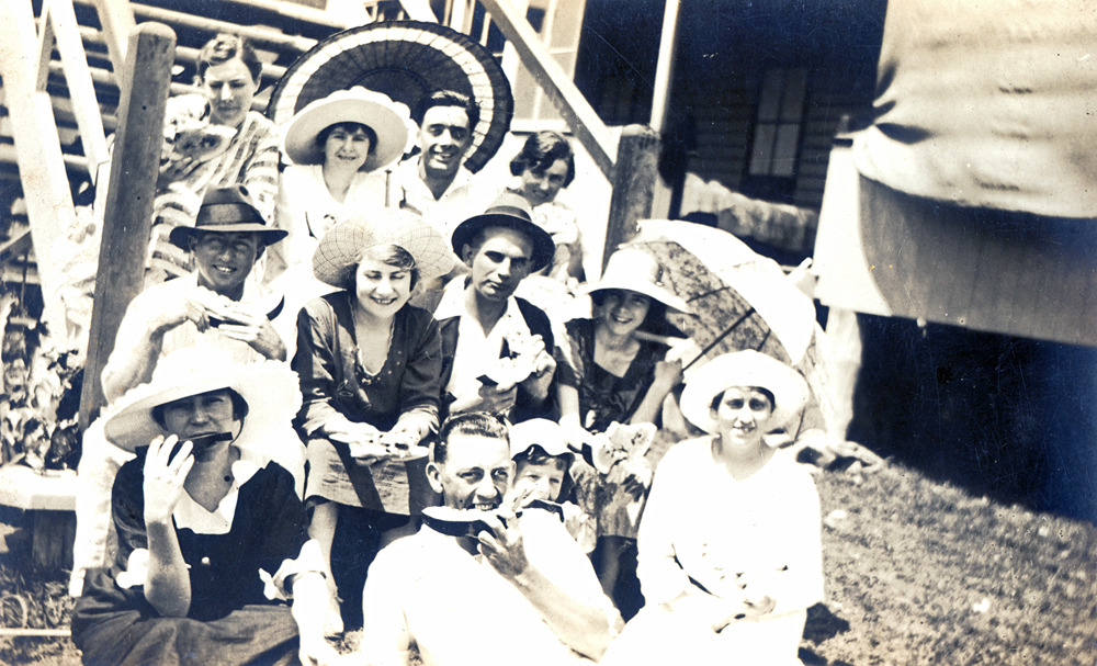 Group of people on steps, thought to be, at the Kruger Sawmill, Bundamba, Ipswich, late 1920s