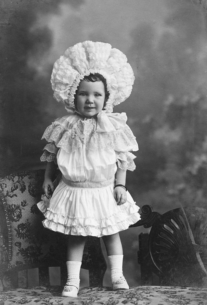 Young  child, in elaborate clothing, Ipswich, 1896-1905