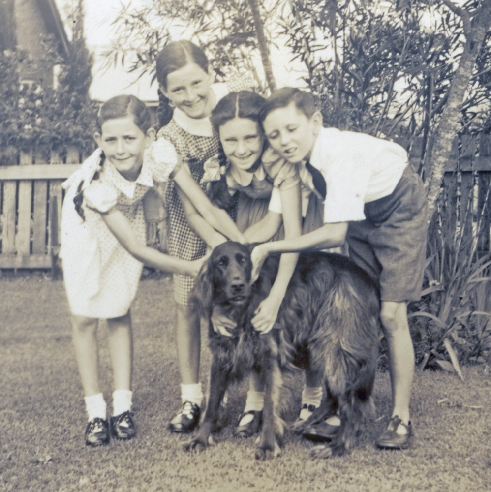 Elspeth and Donald Cameron with their cousins, Janet and Margaret Cameron, and Donald's red setter, 1948
