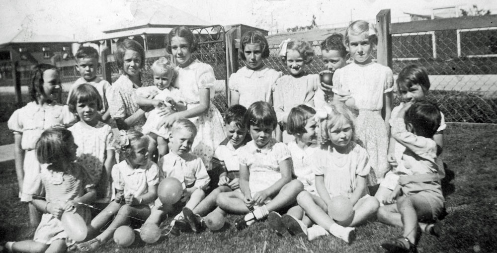 Group of children at fifth birthday party for Norma Jones, Booval, Ipswich, 1940