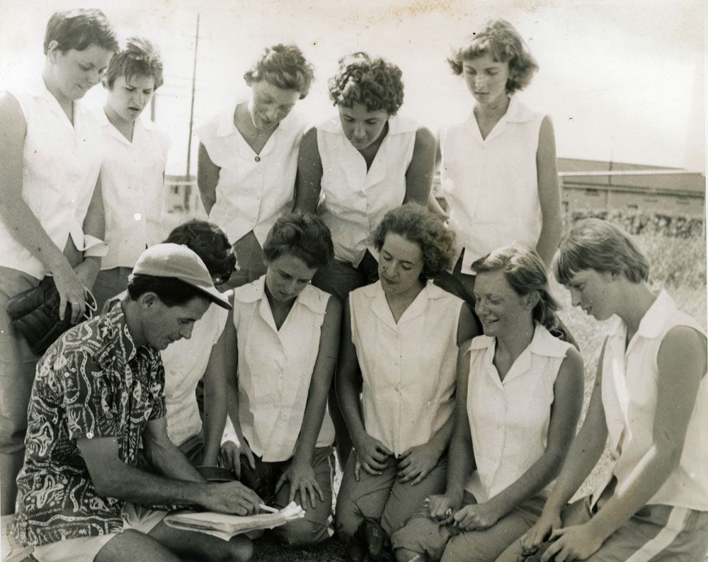 Rocket's Softball Team in discussion with Coach, John Walker, East Ipswich Hockey Grounds, Ipswich, 1955-1956
