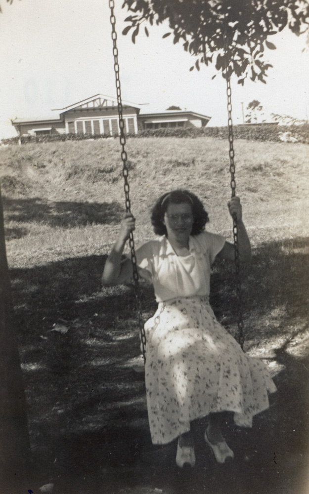 Queens Park, swing with caretaker's residence in the background, Ipswich,1950