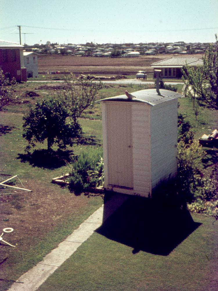 Outhouse with Galah on roof, Warrawong Street, Eastern Heights, Ipswich, 1972
