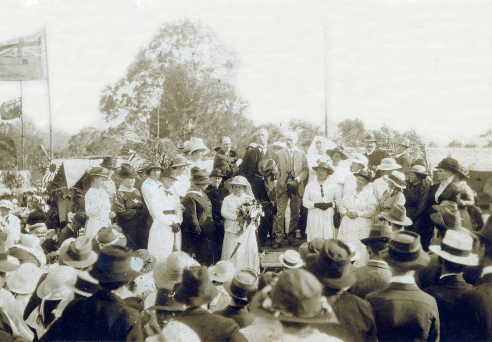 Jean Gilson presented with a bouquet of flowers by the Governor of Queensland, Goodna, Ipswich, 1918