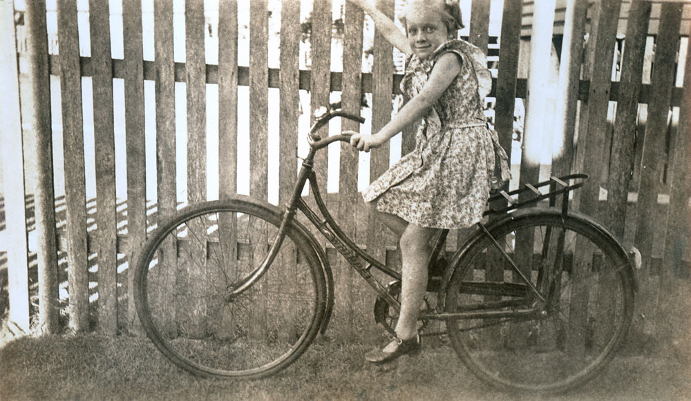 Melva Richards of Booval on her Whippet bicycle, Ipswich, 1949