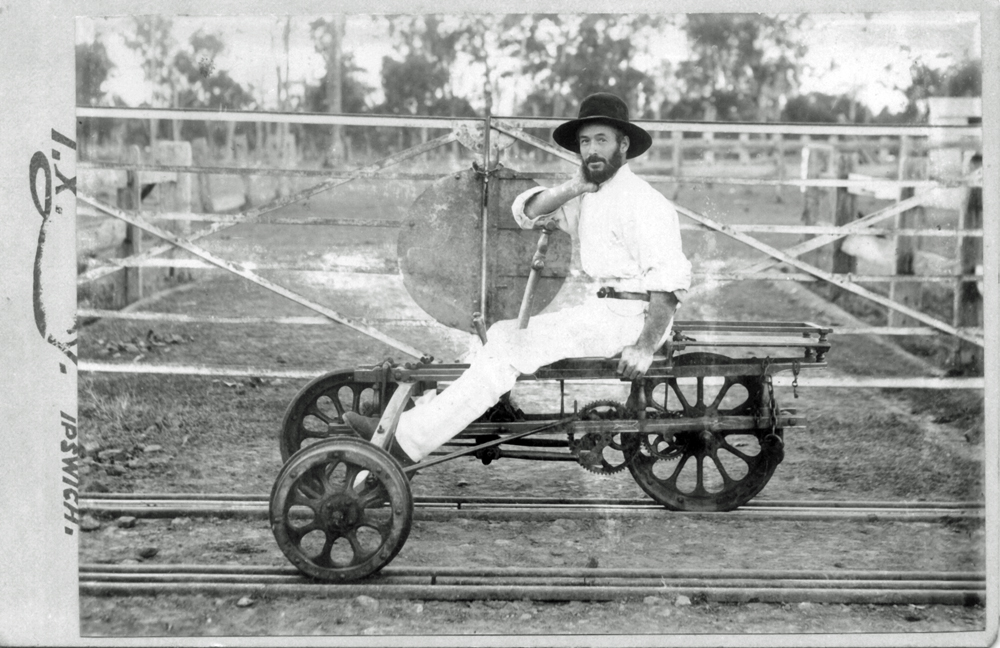 Unidentified rail worker on a rail hand cart (velocipede), Ipswich, c.1900