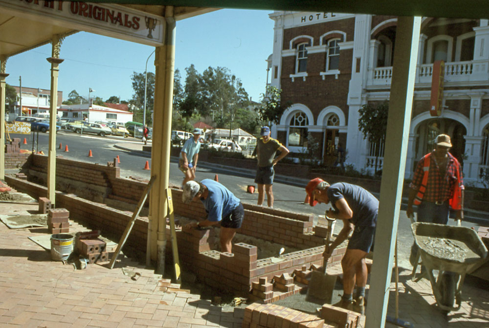 Men landscaping on Brisbane Street, at the corner of Waghorn Street, Ipswich, 1993