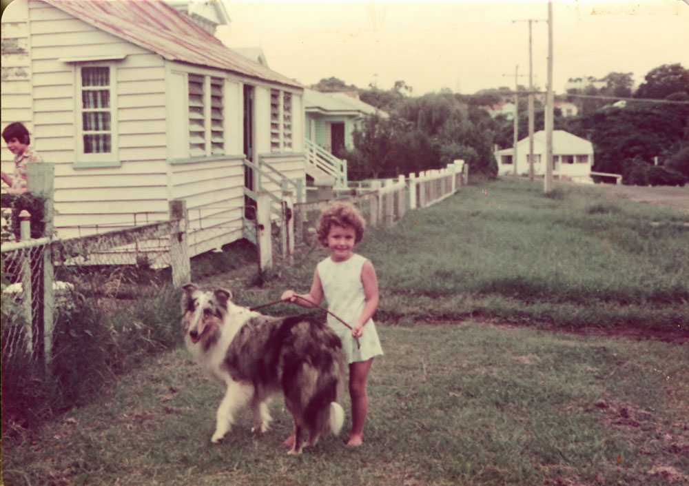 Young girl with dog in front of home in England Street, East Ipswich, 1943