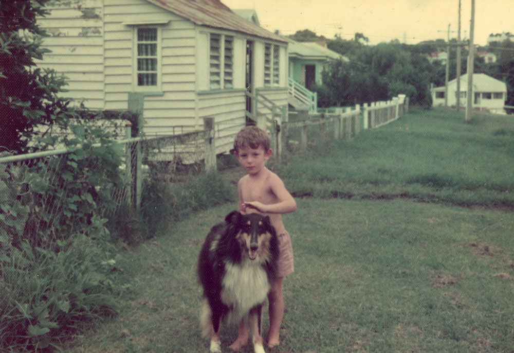 Young boy with dog in front of home in England Street, East Ipswich, 1943