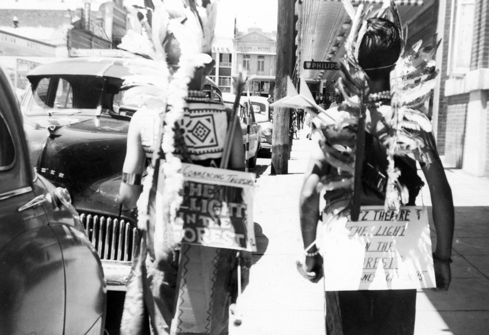 Boys advertising the film 'The Light in the forest' outside the Ritz Theatre, Ipswich, December 1961