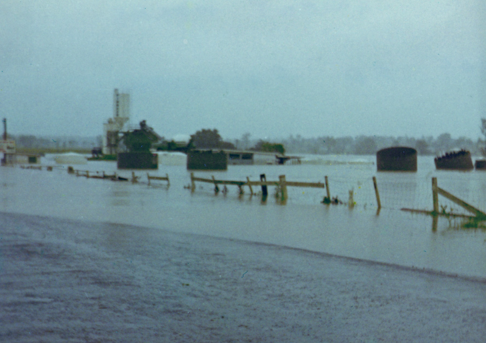 Concrete tanks floating on Briggs Road, Ipswich, during floods of 1974